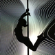 Illustration for article titled Watch This Pole Dancers Gorgeous Interactive Routine with Geometric Light